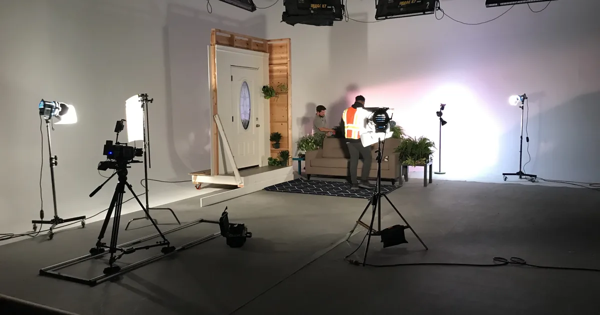 Freestanding door set with camera slider and lighting on a commercial soundstage