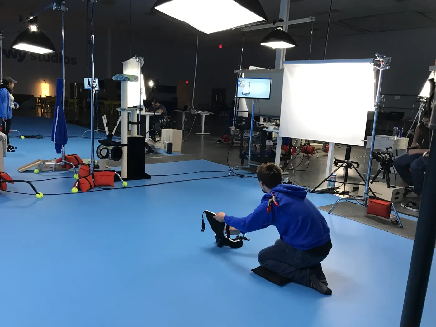 Crew preparing a pet product set on the Chewy studios floor