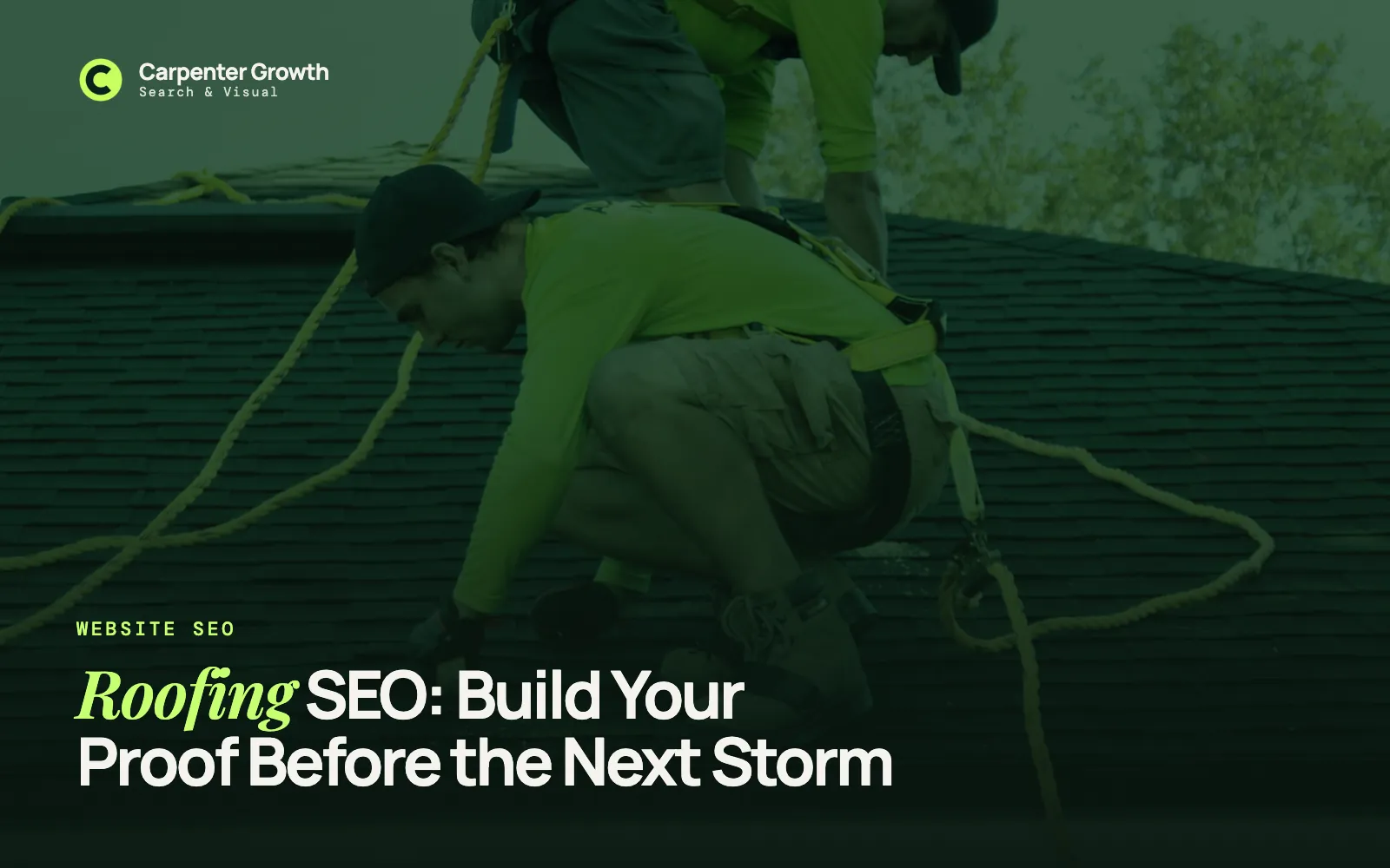 Roofers in safety harnesses working on a shingle roof